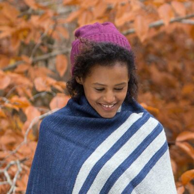 Swans Island Company's Bar Island Hat with matching Bar Island fingerless mitts. Knit with soft silk/merino wool. 100% made in USA with hand-dyed yarns. Shown here in Aubergine.