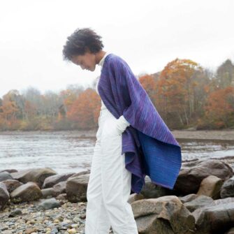 Swans Island Watercolors Cape is handwoven in Maine using our unique hand-dyed yarn. We dye our own yarns using all natural dyes on soft organic merino wool. Indigo/Beetroot colorway.