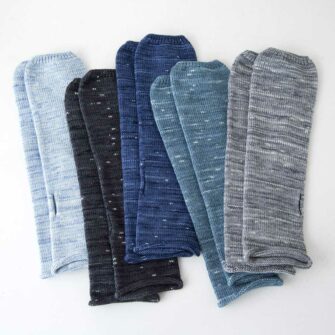 Swans Island Company's fingerless Firefly Mitts. Exclusively available at Swans Island, these mitts are knit in the USA with a hand-dyed soft silk/merino wool blend. Flecks of white on a dark ground give a unique pattern to these mitts.