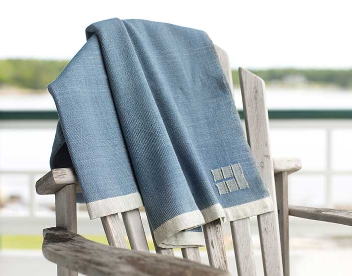 blue throw on chair back