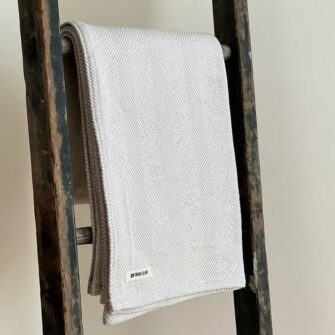 Swans Island's Savannah Throw blanket is woven in Maine with 100% natural cotton.