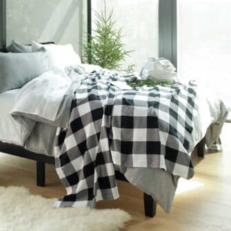 Swans Island Company's Cotton Gingham XL Check Blanket - woven in Maine on antique looms. Made with 100% soft American cotton. Shown here in Black and White.
