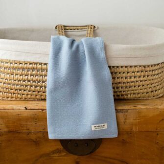 Swans Island Company's Cotton Acadia Baby Blanket. Woven in Maine with hand-dyed American cotton. Shown here in Wedgwood.