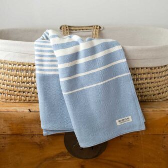 Swans Island Company's Cotton Penobscot Baby Blanket. Woven in Maine with hand-dyed American cotton. Shown here in Wedgwood.