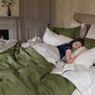 Swans Island Company's Farmhouse Linen Bedding Bundle. Includes 1 Classic Linen Sheet Set in flax + 1 Relaxed Linen Duvet Set in Rosemary.