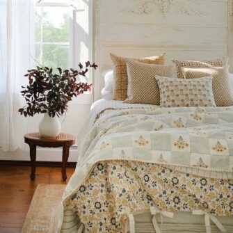 Swans Island Abha Duvet Cover by Soil to Studio. Block printed by hand in India with bright playful patterns. Shown here in natural with gold and blue floral.