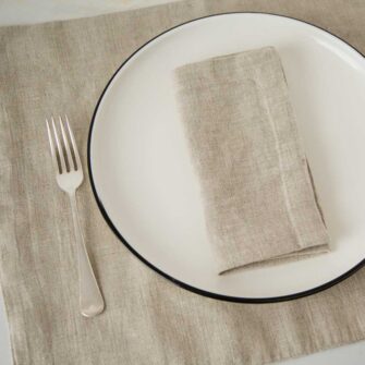 Swans Island Company's linen placemats by Linen Tales, made with 100% European Linen Oeko-Tex® and EUROPEN FLAX® certified. Made with stonewashed soft linen with mitered corners for a crisp edge. Shown here in Natural Flax color.