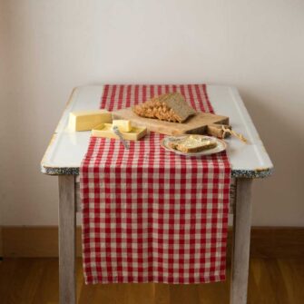Swans Island Company's linen table runner by Linen Tales, made with 100% European Linen Oeko-Tex® and EUROPEN FLAX® certified. Made with stonewashed soft linen with mitered corners for a crisp edge. Shown here in Red and Natural Flax Gingham Check.