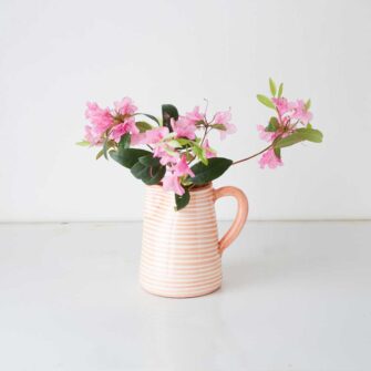 Swans Island Company's Striped Terracotta Pitcher - Handmade in Portugal. Shown here in Terra Cotta and White